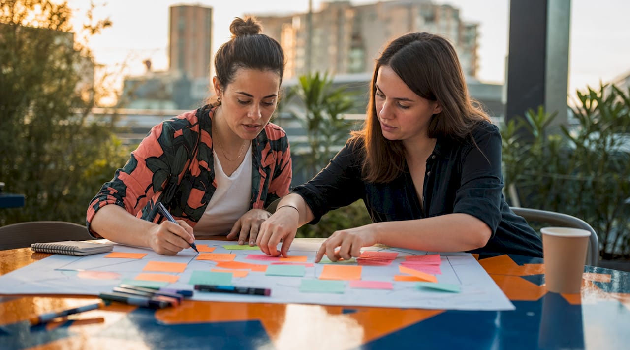 Hands assembling business model canvas