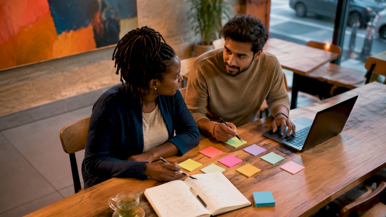Two founders discussing startup idea validation