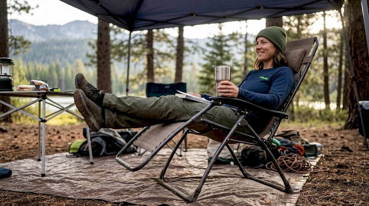 Woman relaxing in zero-gravity camp chair