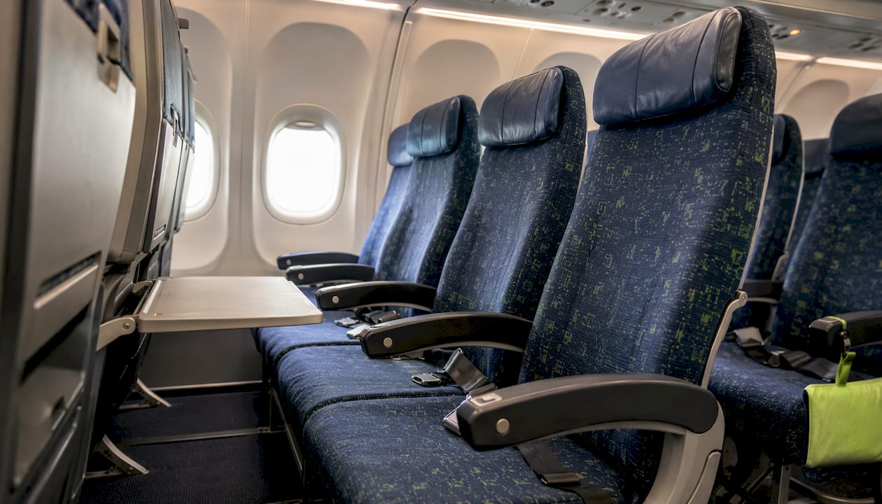 Airplane economy seats showing pitch and recline