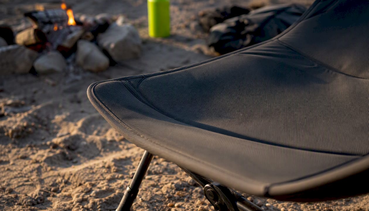 Close-up of ergonomic chair seat pan edge outdoors