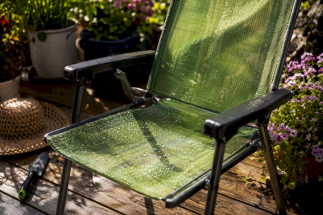 Mesh lawn chair drying in sunlight
