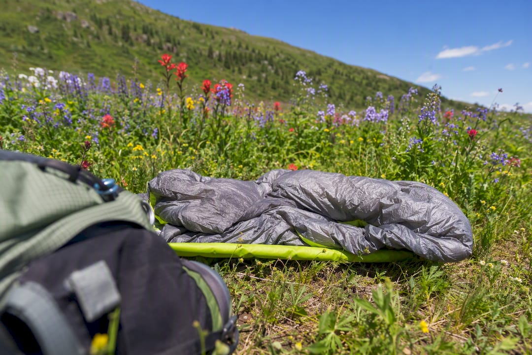 Ultralight quilt and sleeping pad in forest