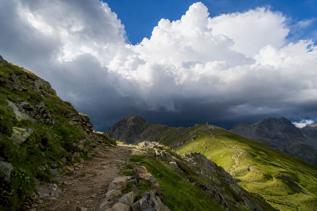 Storm clouds building over an alpine ridge