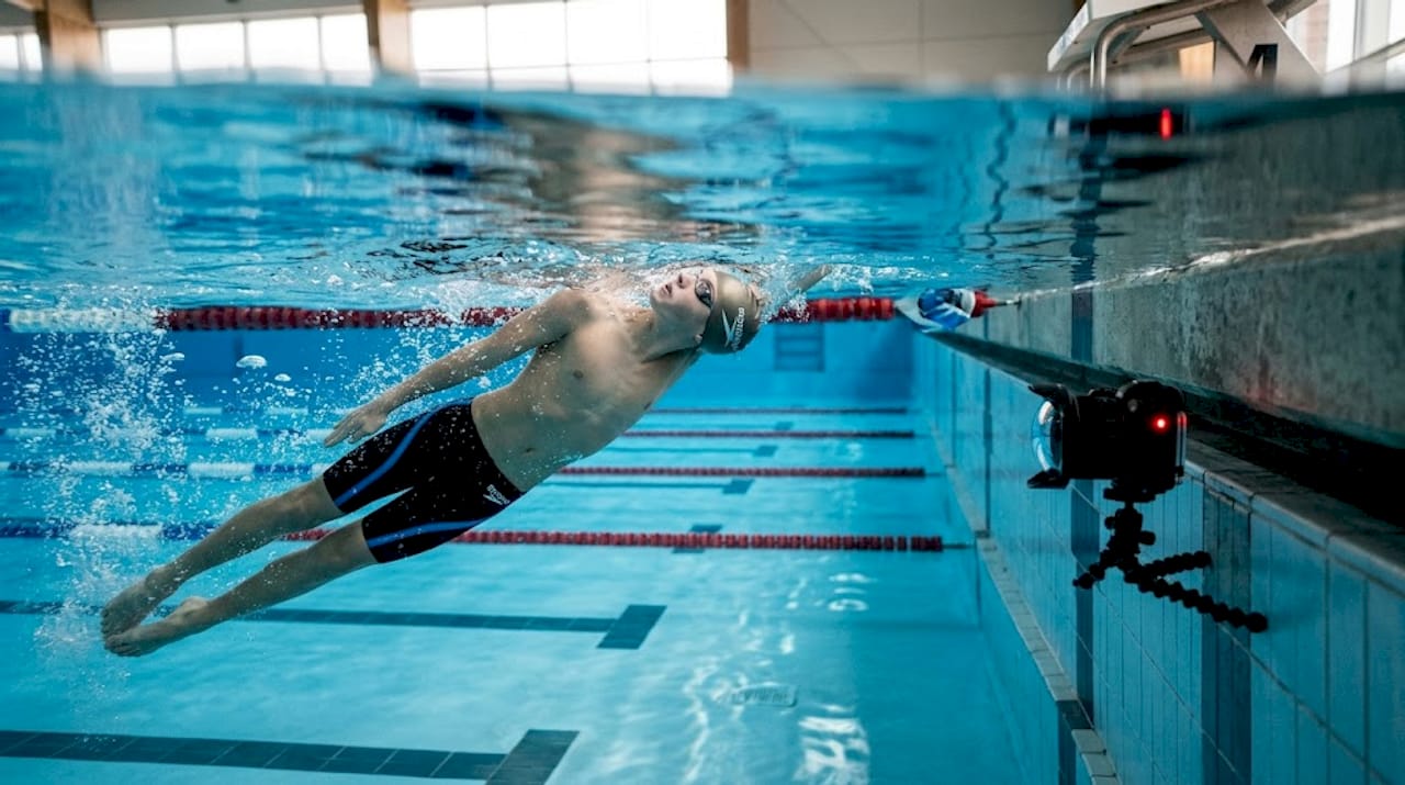 Underwater camera capturing swimmer backstroke form