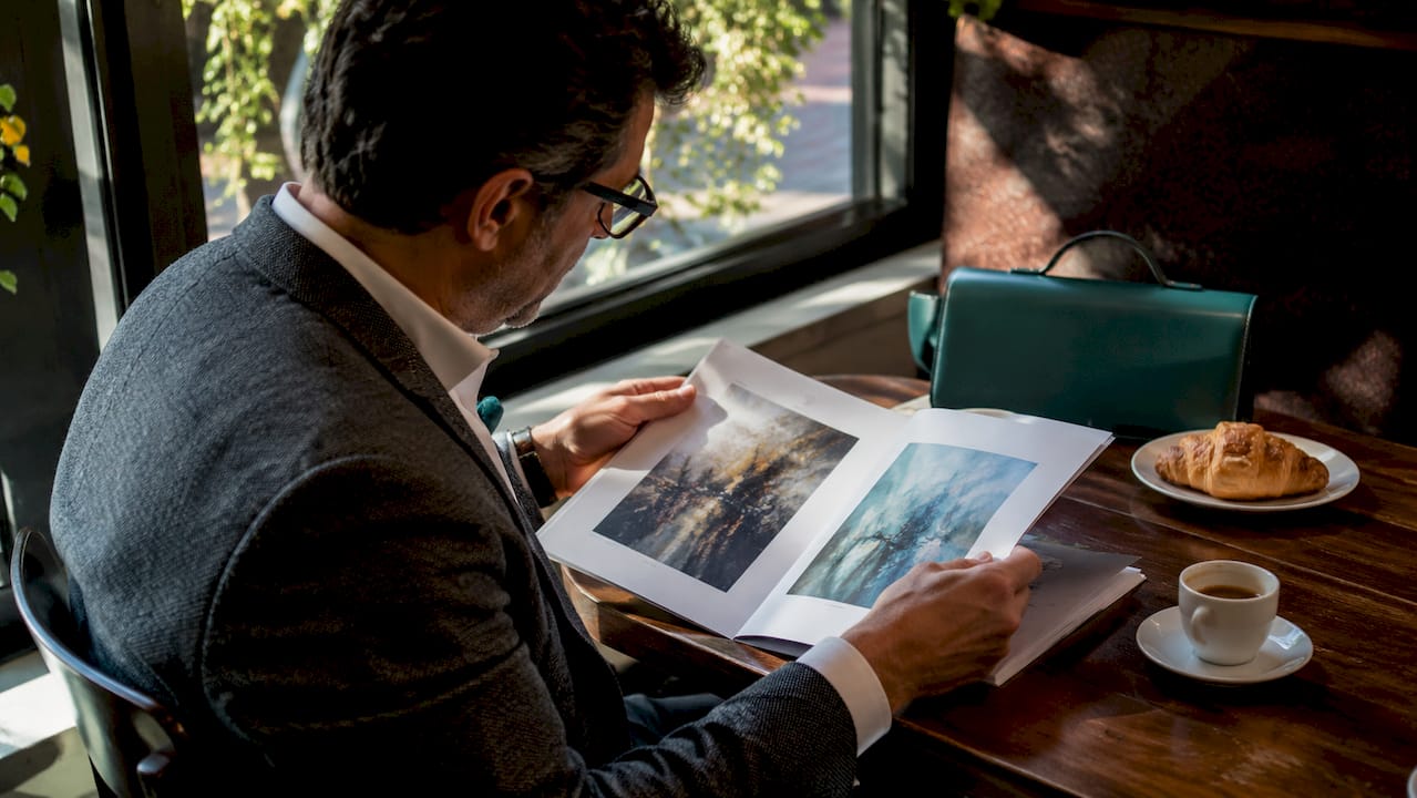 Collector reviewing Art Basel previews