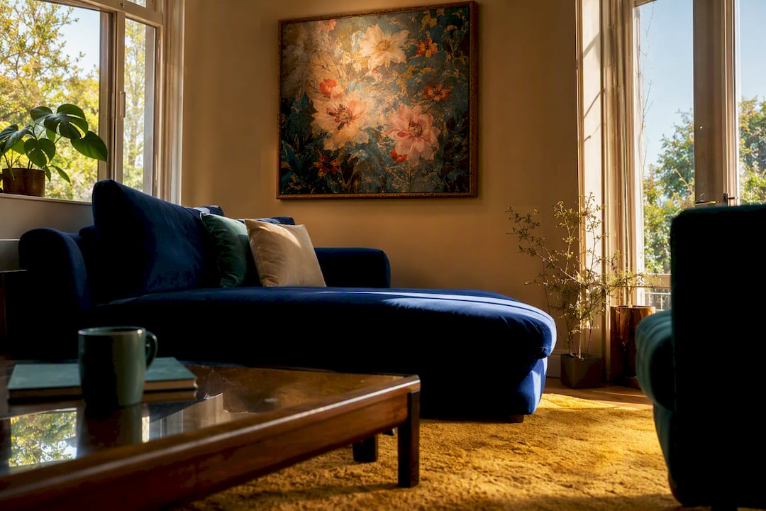 North-facing living room with warm charcoal walls and art
