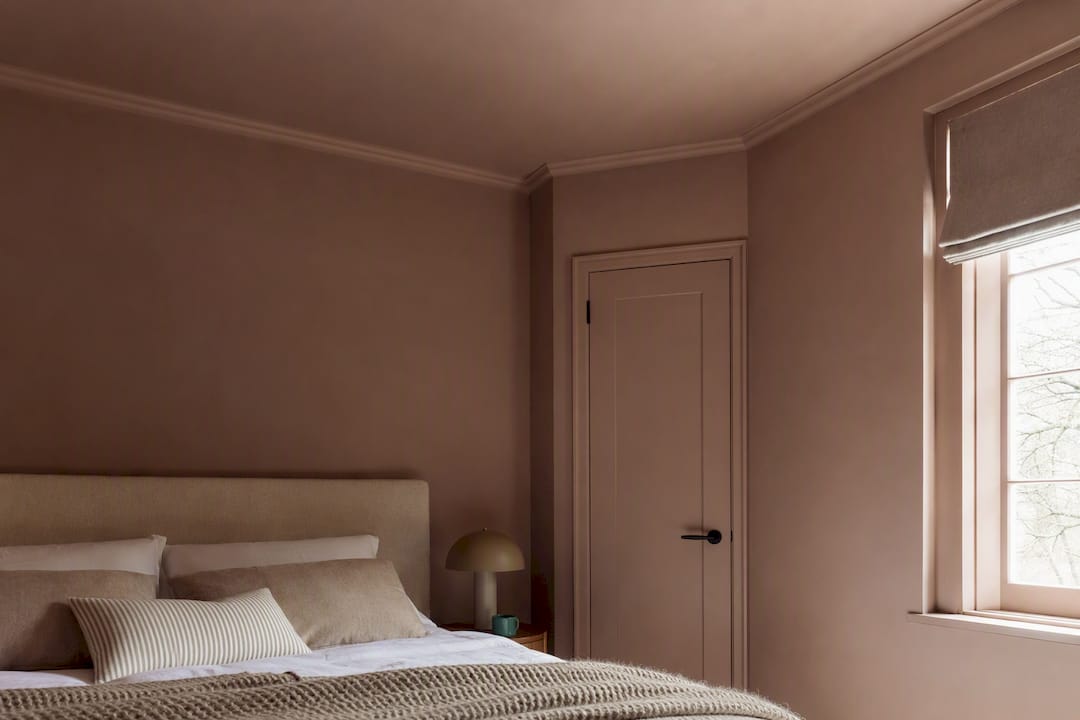 Color-drenched bedroom with coordinated ceiling