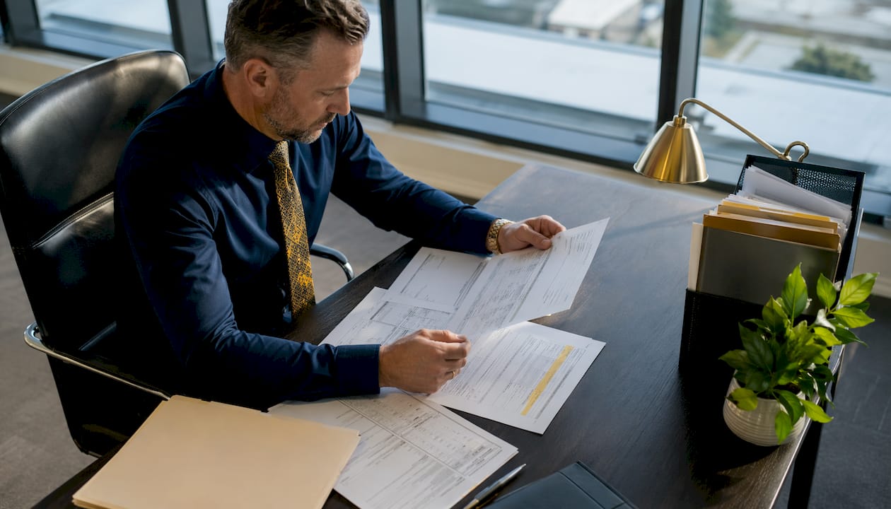 Customs broker reviewing shipping documents