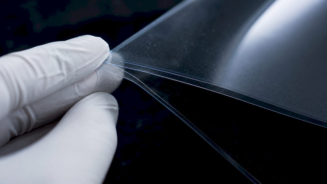 Close-up of ceramic tint film layers and particles