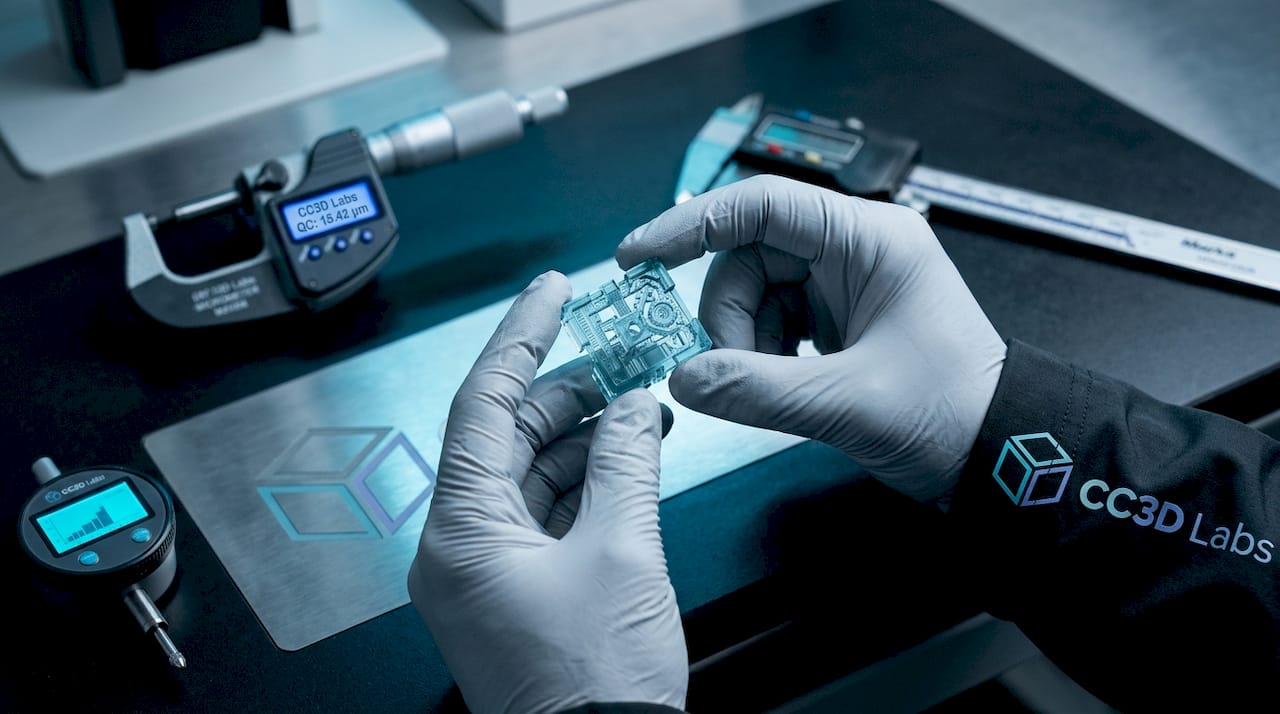 Hands holding 3D printed microcomponent