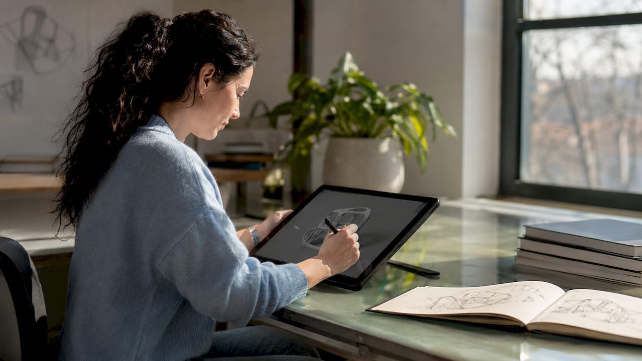 Hands using graphic tablet for CAD design