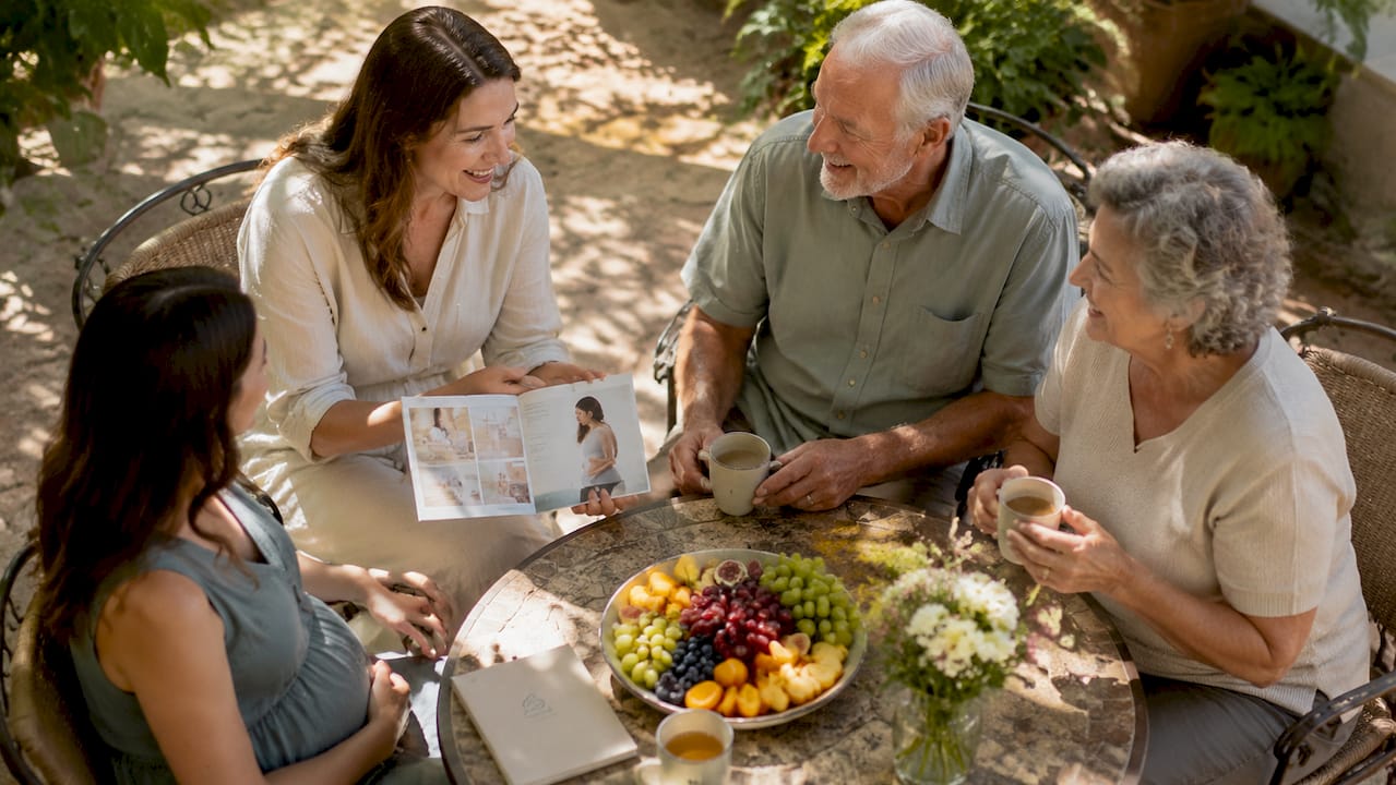 Family discussing birth preparations at table
