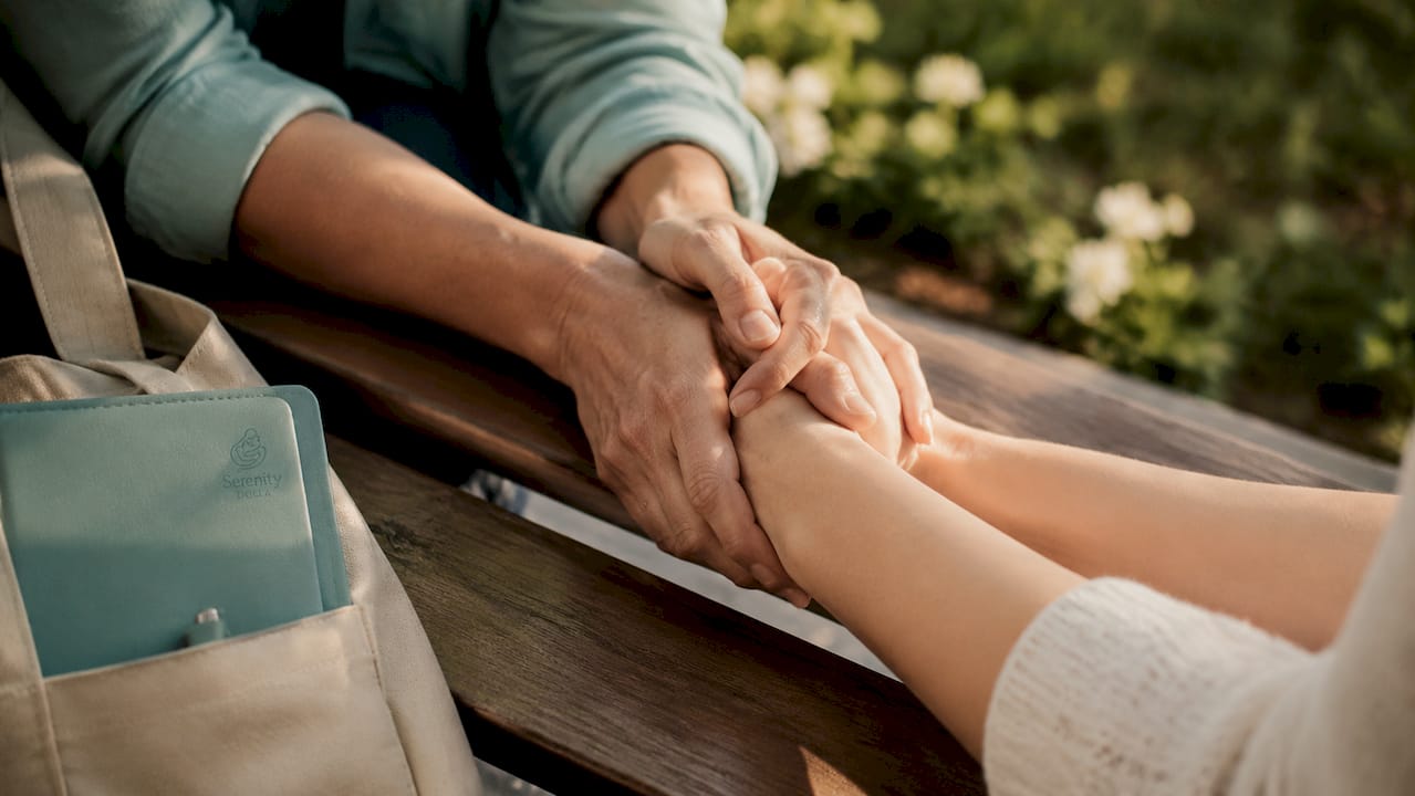 Hands clasped in labor support