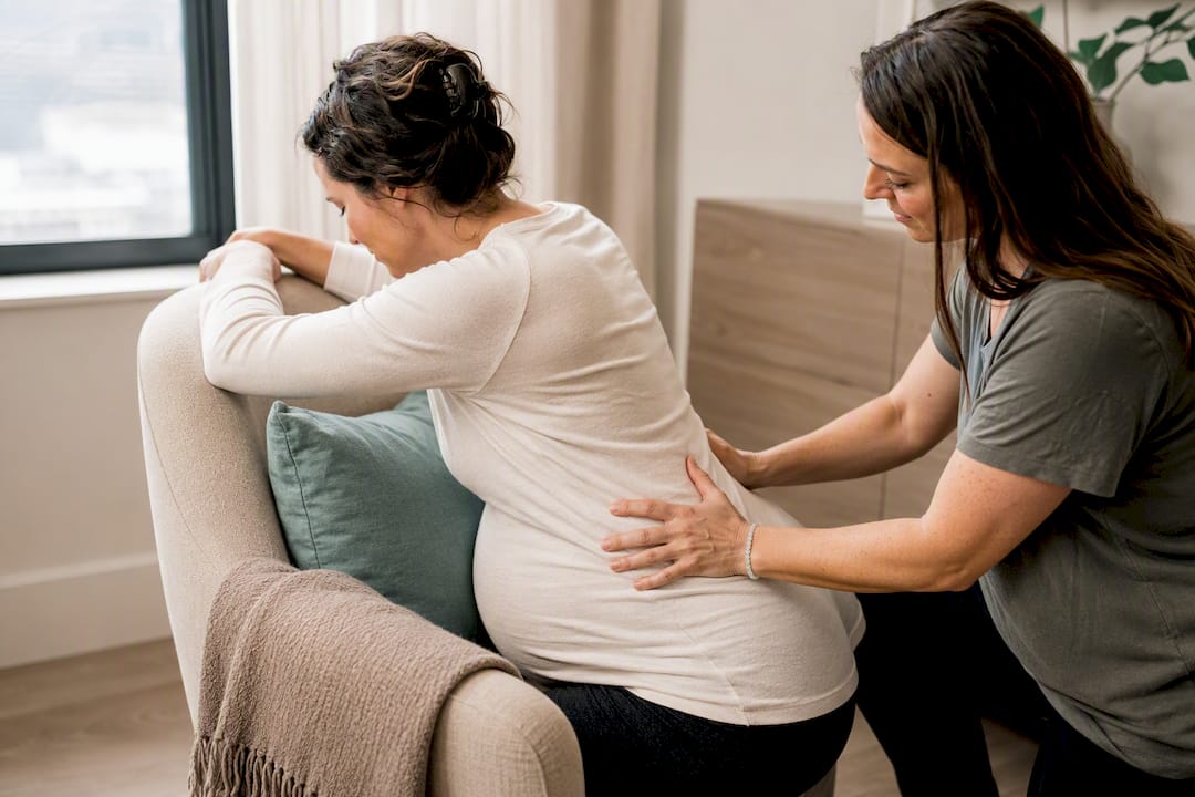 Doula demonstrating labor comfort technique