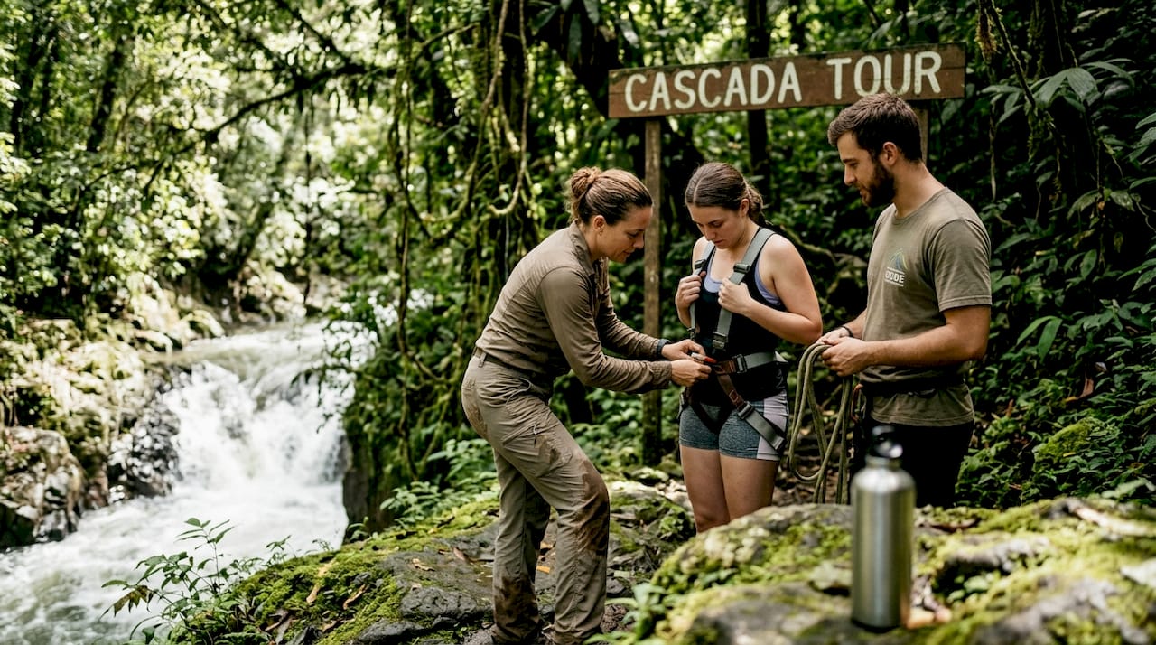 Guides assist guest for Jacó canyoning tour