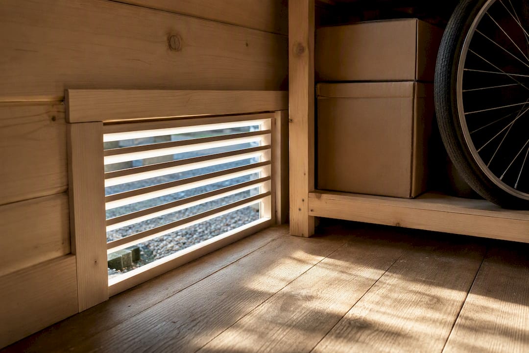 Ventilation panel for airflow in garden office storage bay
