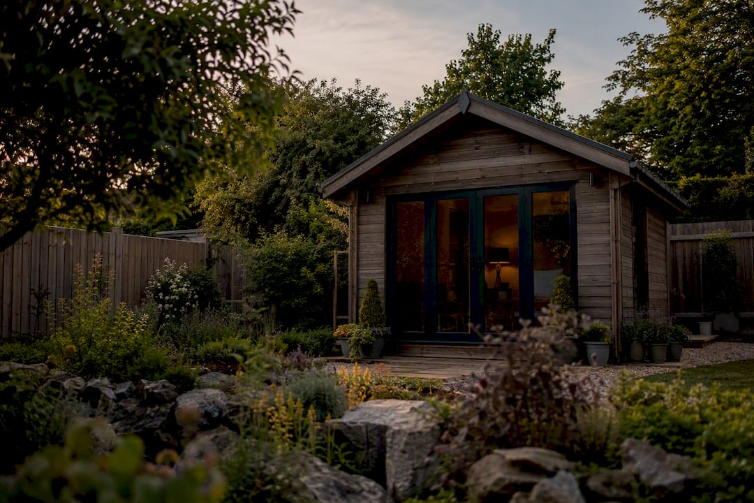 Traditional timber cladded garden room in UK garden