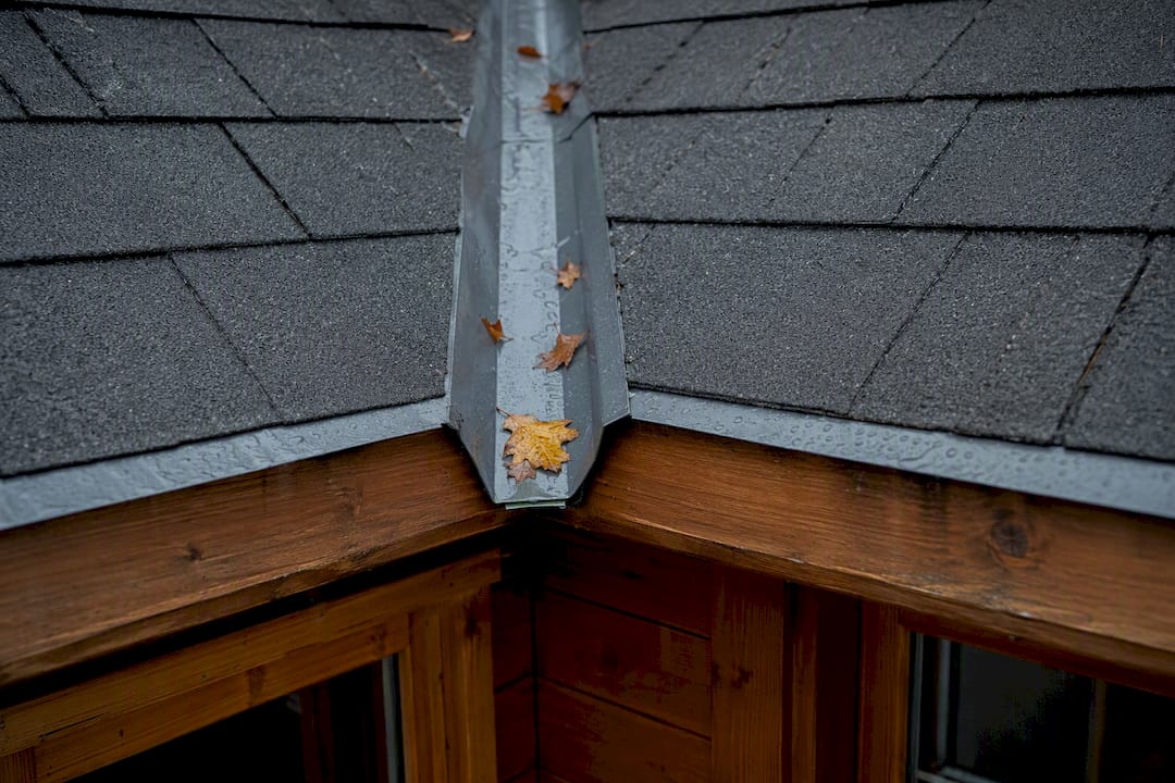 Close-up of roof valley gutter on L-shaped garden room