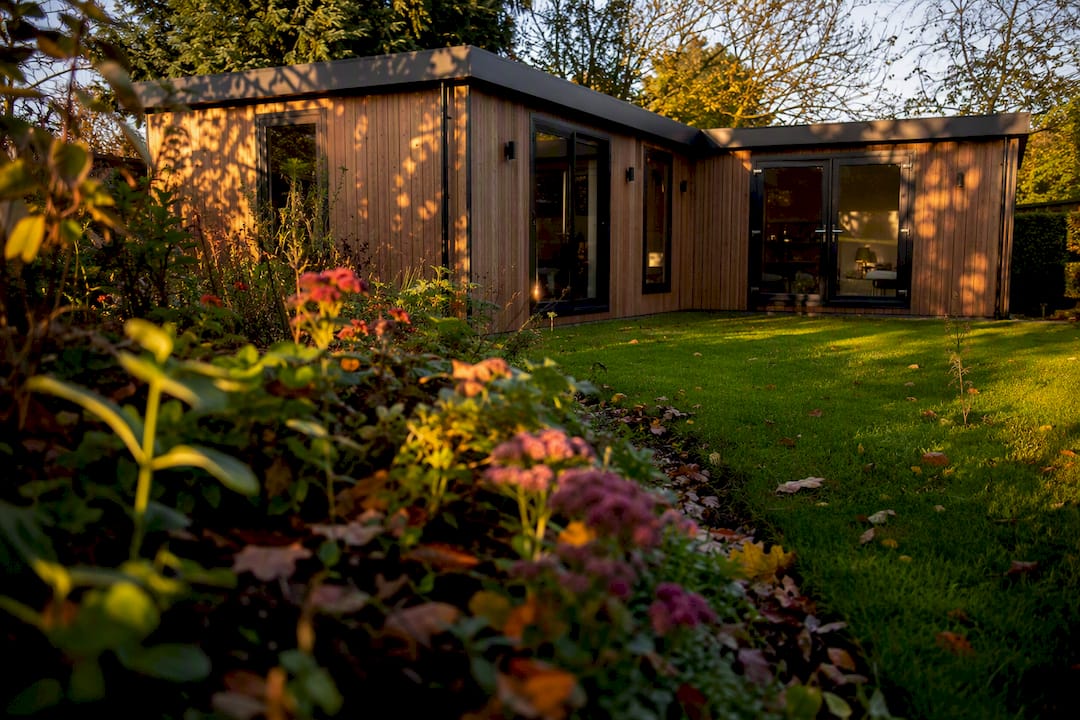 Sunlight and shadows on L-shaped garden room exterior