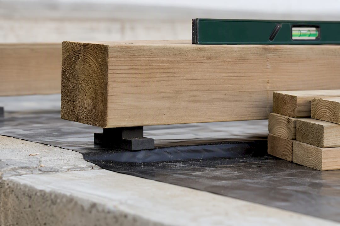 Treated timber bearer above damp-proof membrane