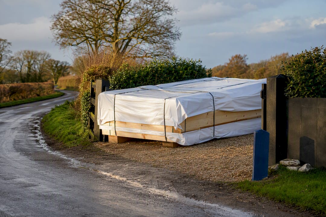 Rural access lane beside timber delivery load
