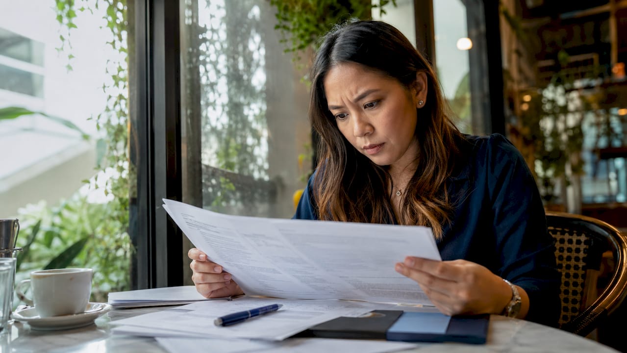 Filipino expat reviewing attestation papers