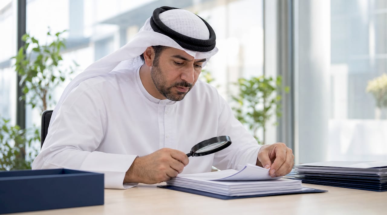 Visa officer inspecting family visa application file