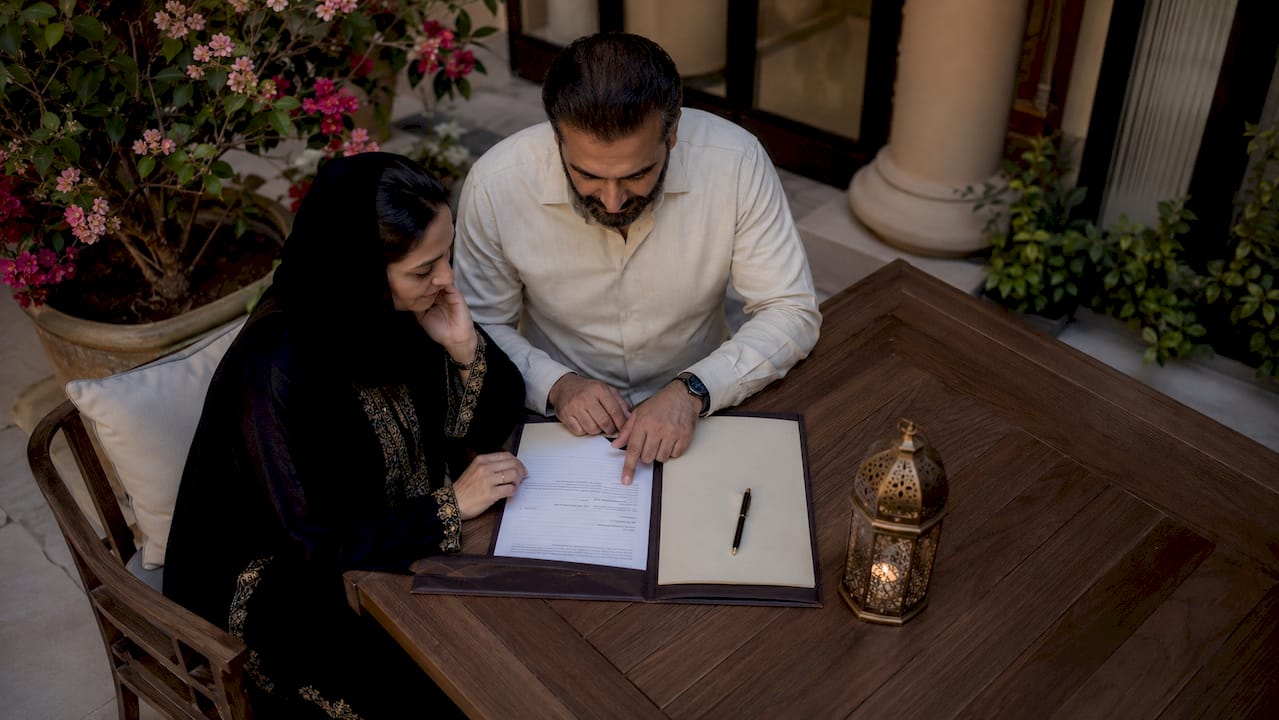 Couple reviewing court marriage documents in UAE