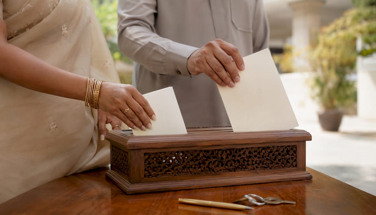 Couple submitting marriage registration documents