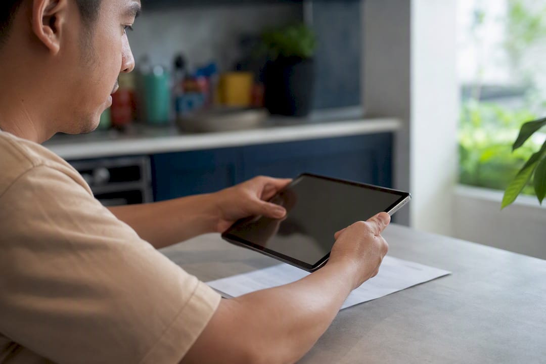 Hands scanning document with smartphone