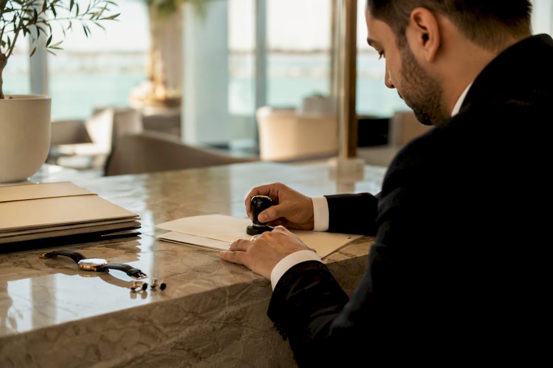 Legal specialist stamping prenup document