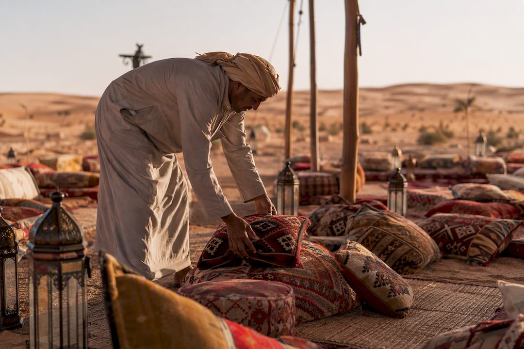 Decorative Bedouin camp seating in desert wedding
