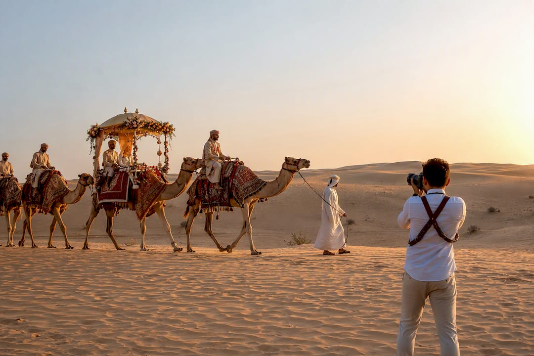 Camel procession at desert wedding ceremony