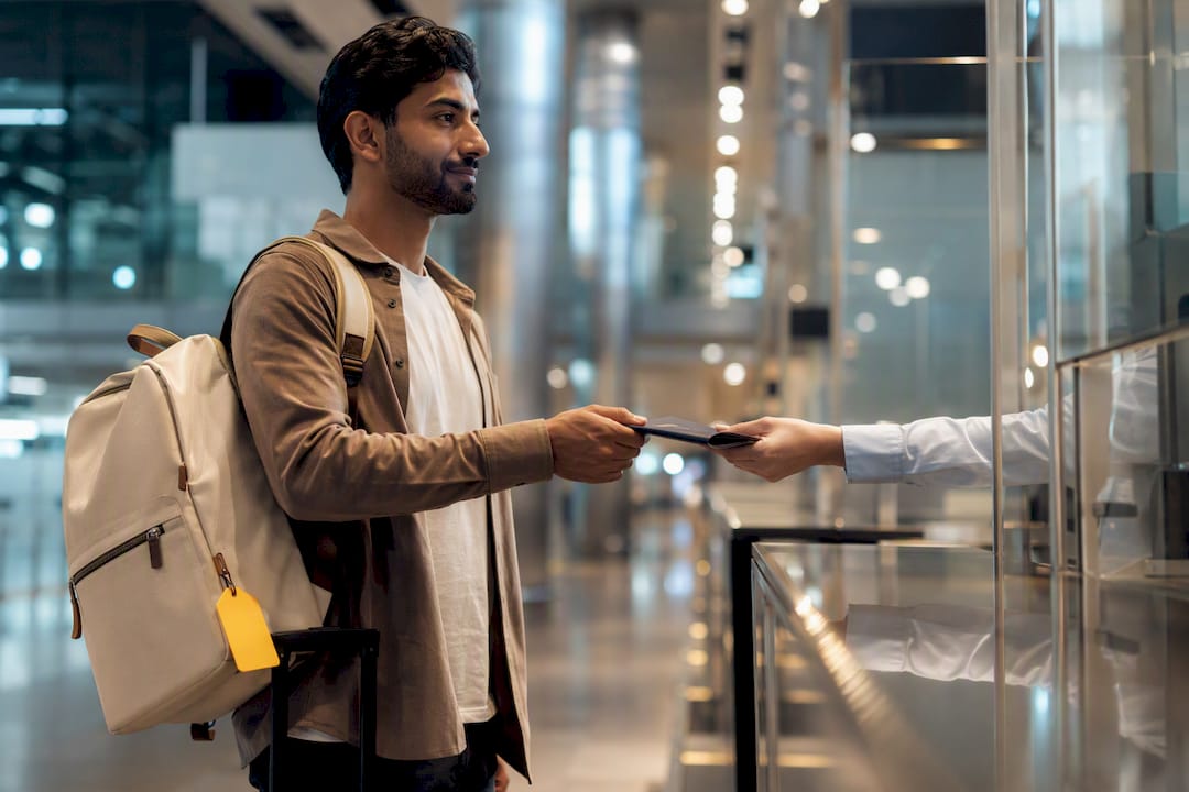 Traveler presenting passport at UAE immigration