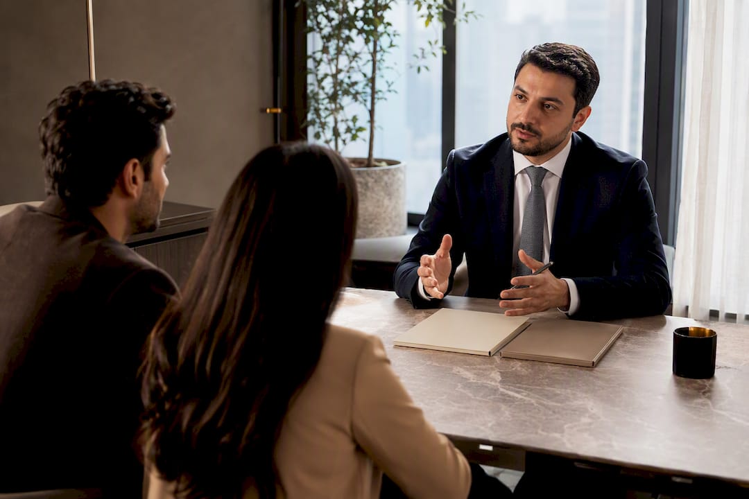 Couple discussing UAE marriage options with lawyer
