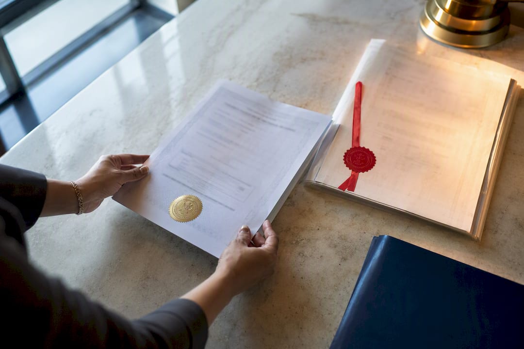 Apostille certificate beside red ribbon seal