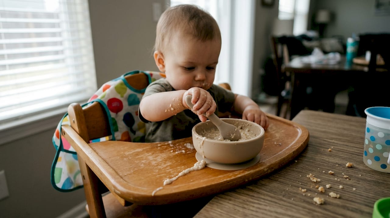 Baby self-feeding with silicone spoon and bowl