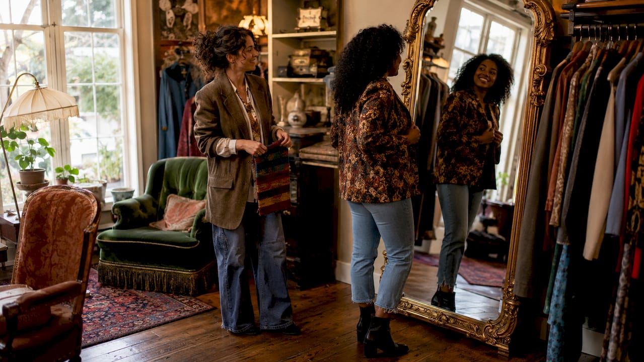 Personal shopper consulting client in boutique