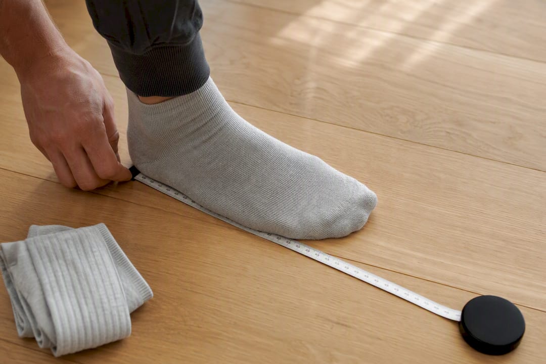 Foot measured heel to toe with tape