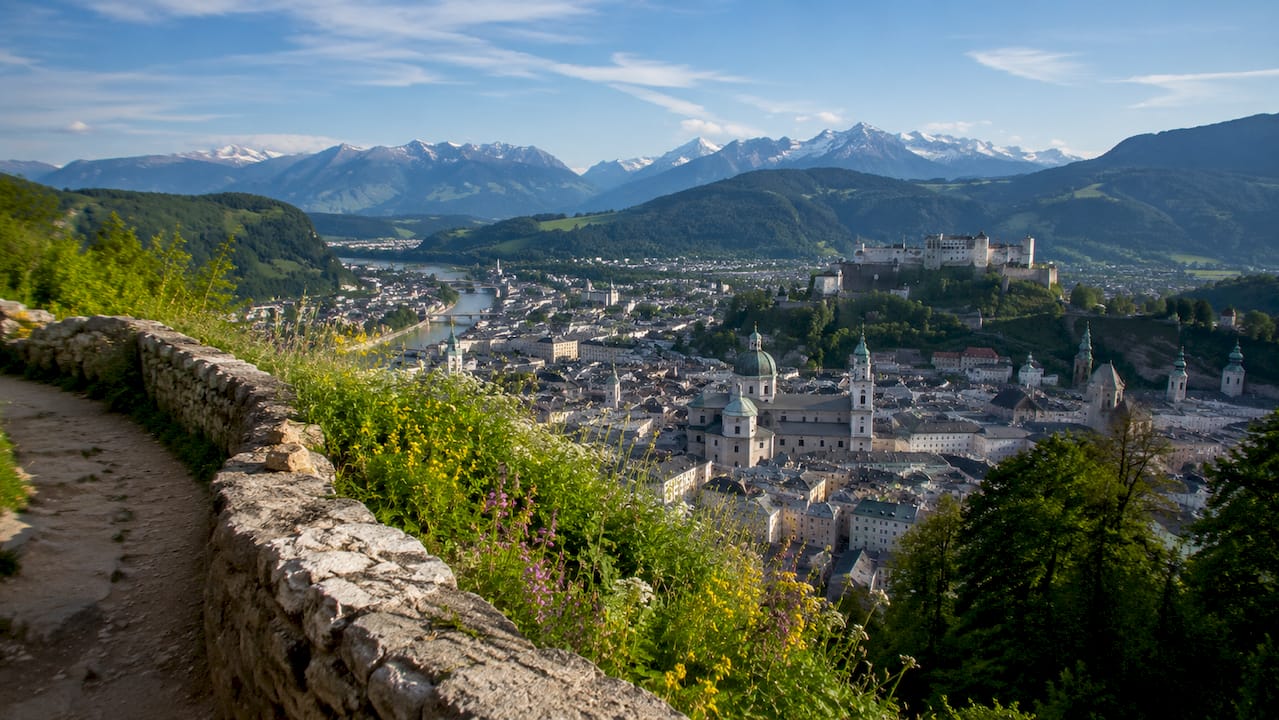 Scenic Salzburg city with alpine mountains