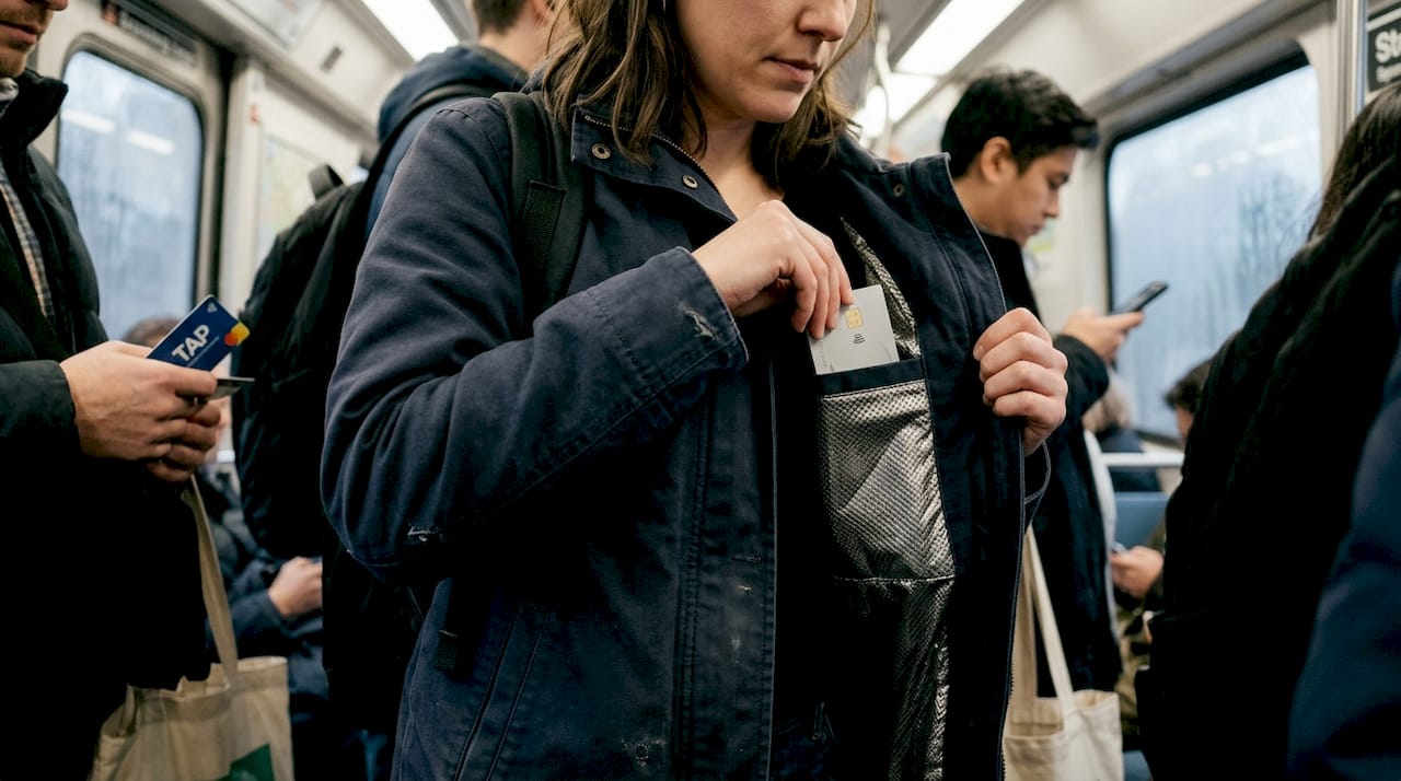 RFID-blocking pocket being used on train