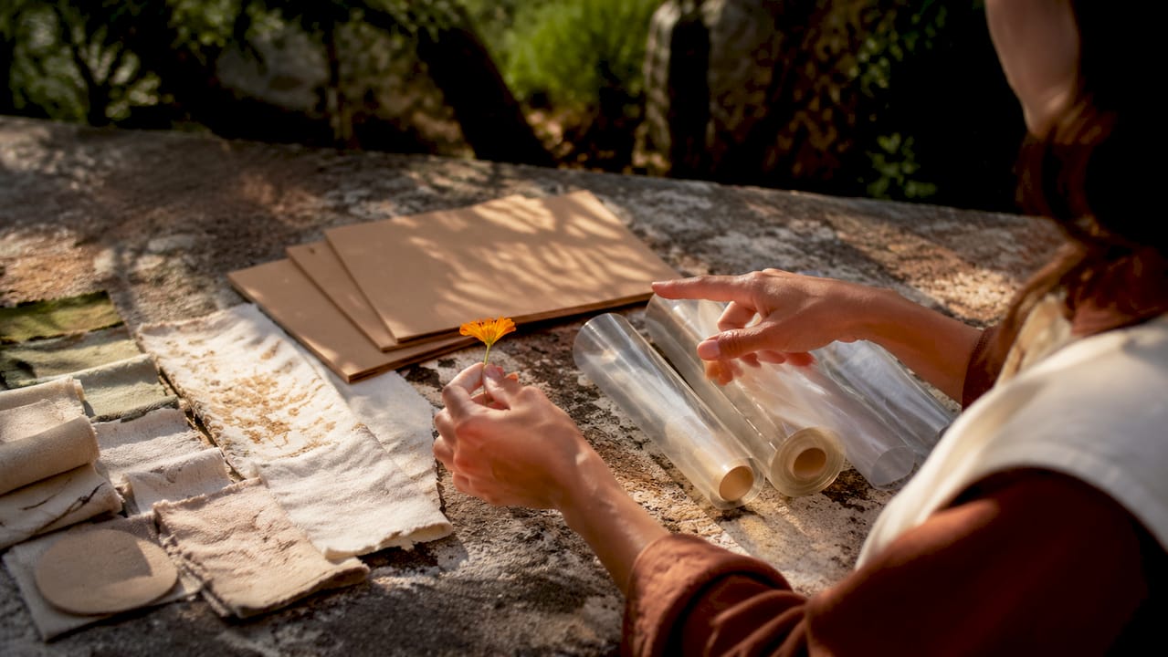 Hands comparing eco-friendly wrap materials