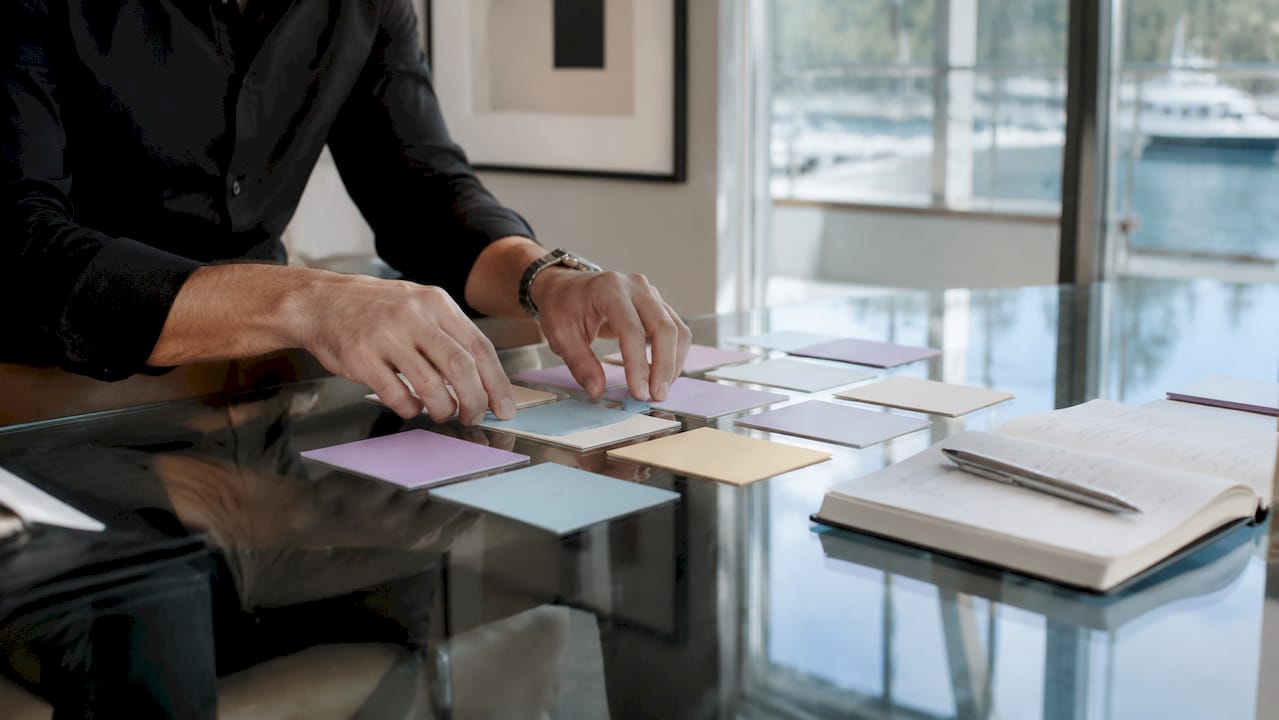 Hands sorting lead persona cards