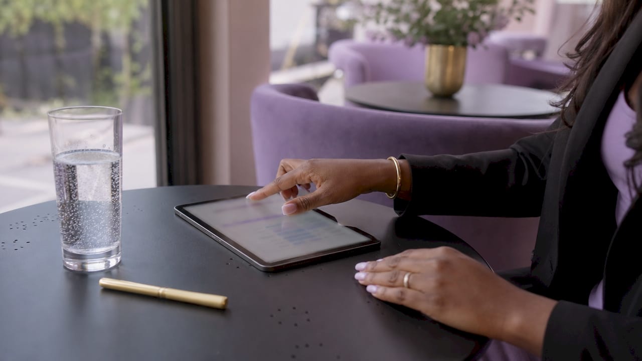 Hands navigating sales pipeline on tablet