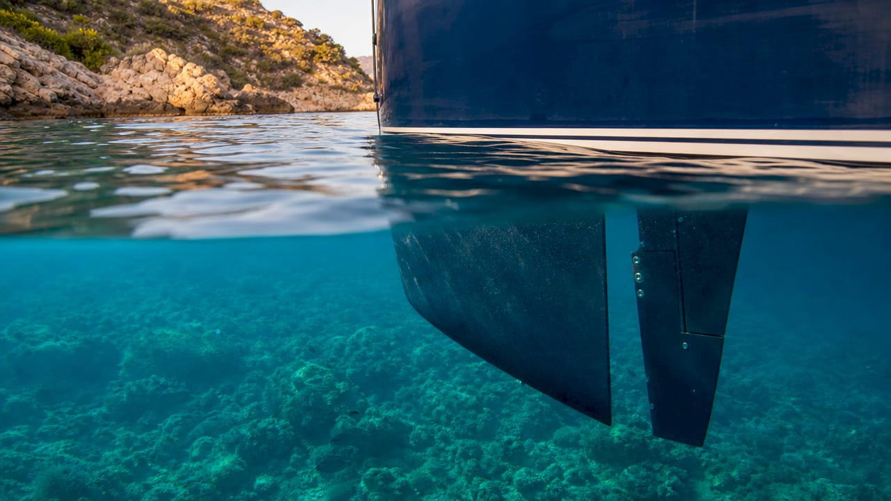 Close-up underwater yacht keel and rudder view