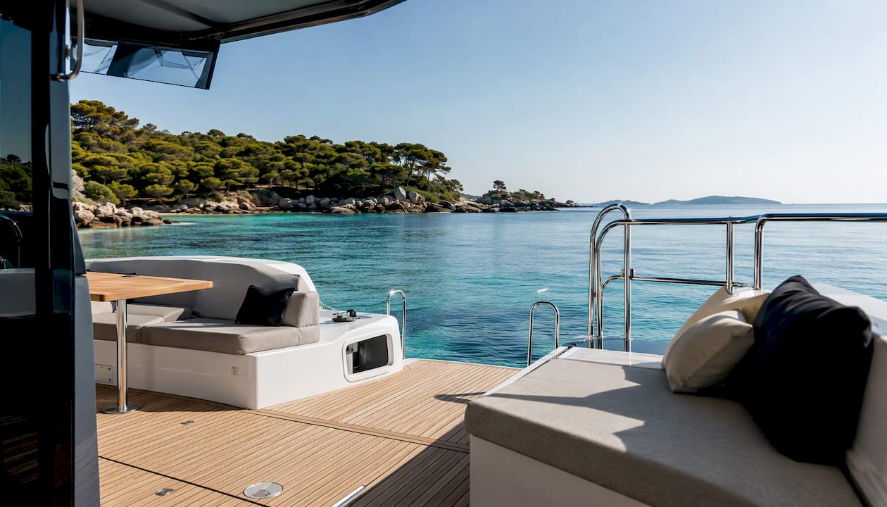 Power catamaran wide deck at anchor