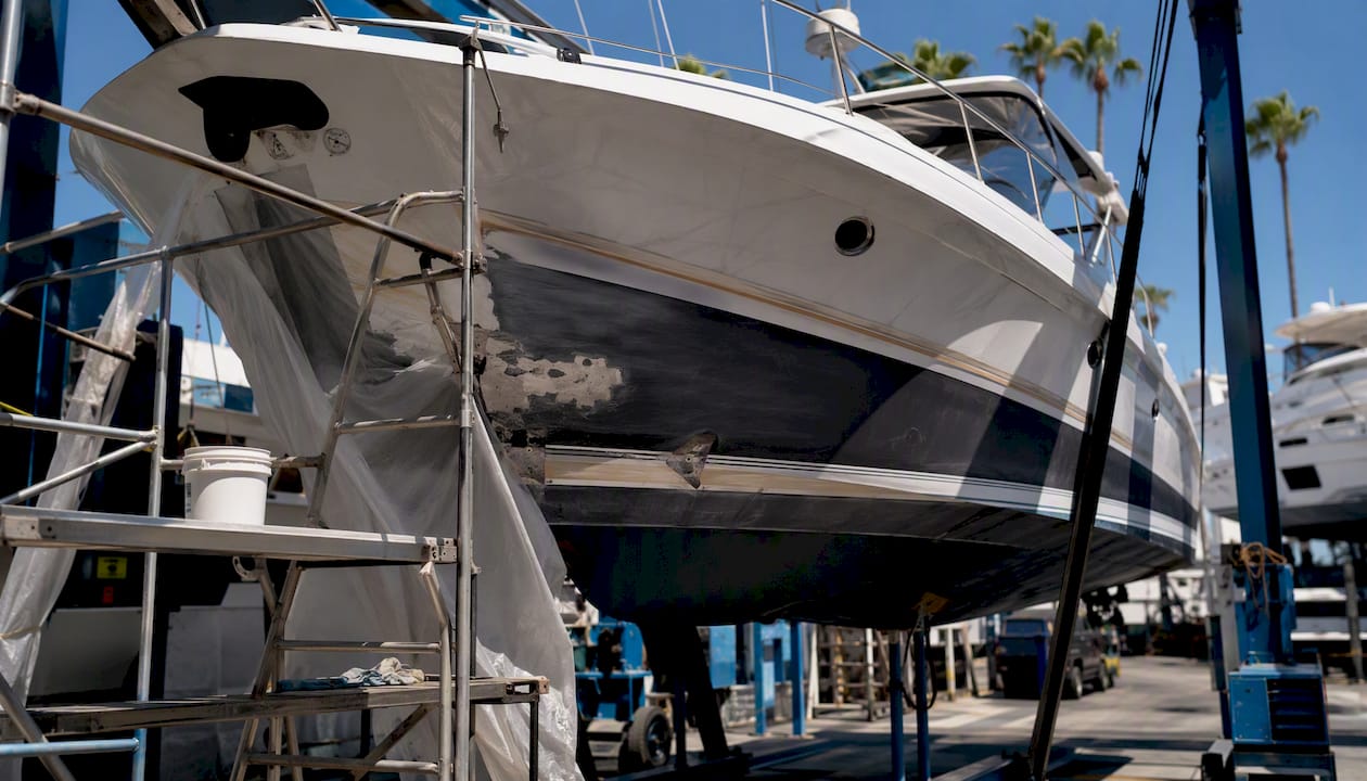 Boatyard with yachts lifted for repainting in South Florida