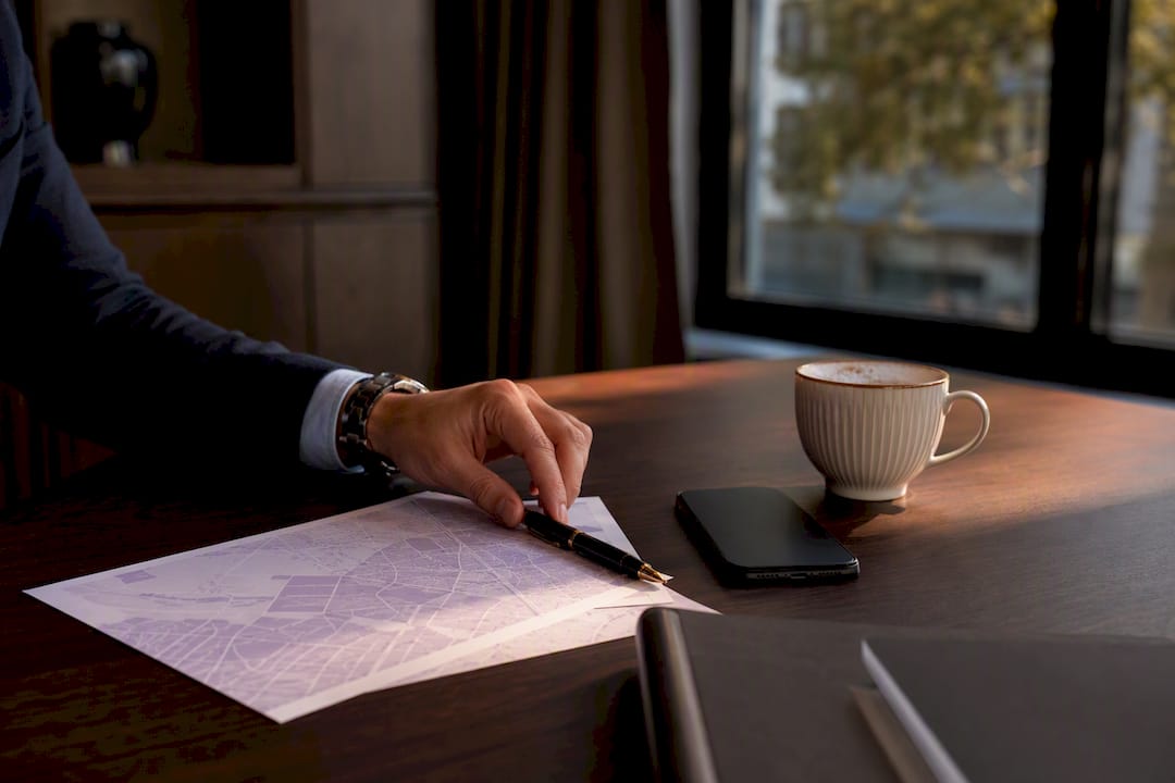 Desk with neighborhood map and coffee cup