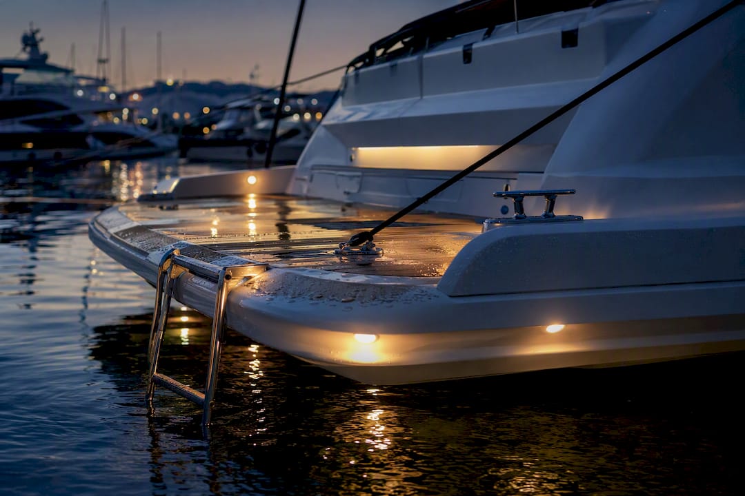 Yacht swim platform illuminated by motion-activated lights